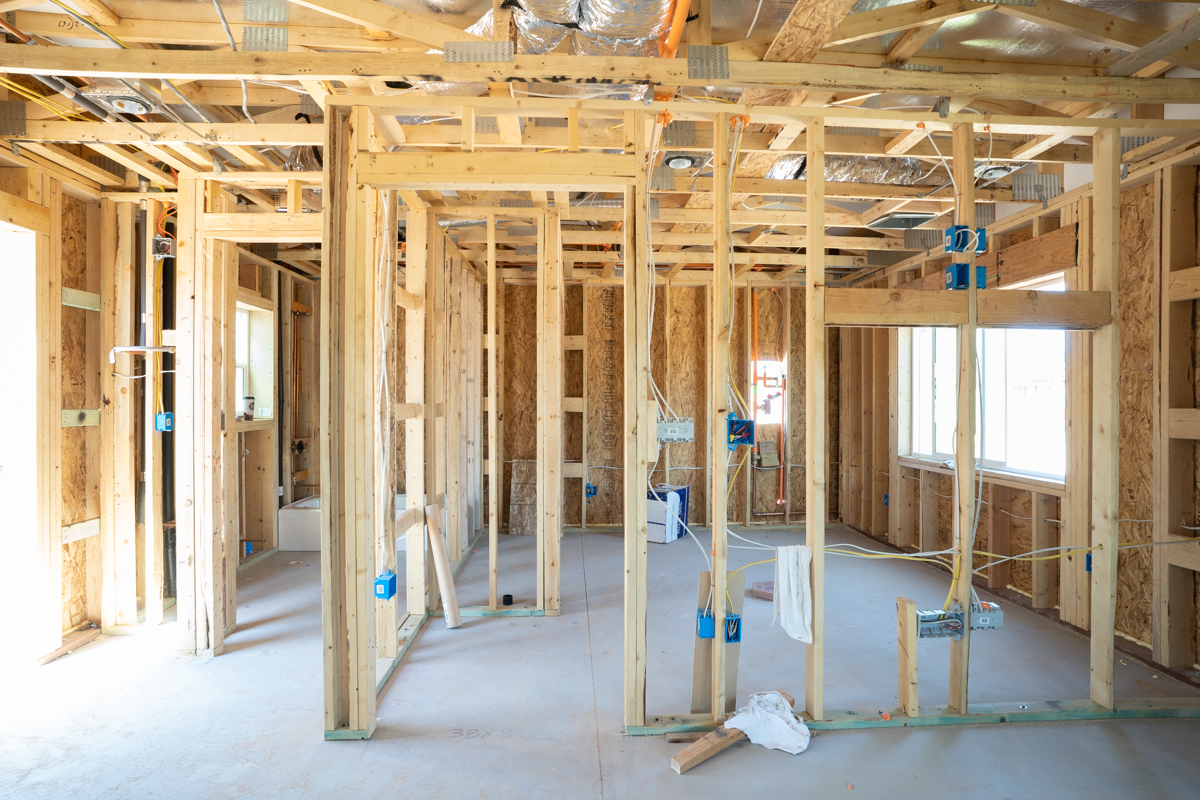 Interior wood framing of a remodel — bare studs and new wiring